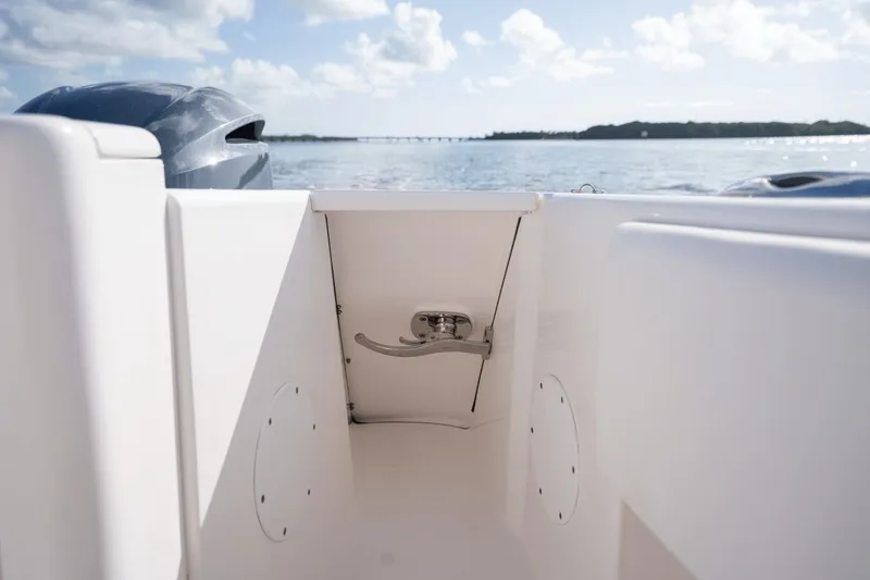 Slide: The Image of 2015 Intrepid 327 CC INFUSED boat interior with ocean view and clear sky. - 26