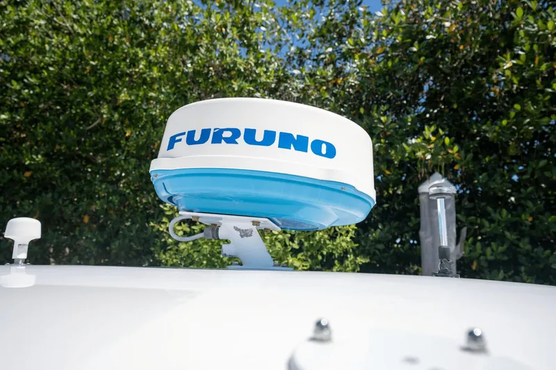 Slide: The Image of Furuno radar on 2005 Intrepid 348 WA boat against leafy background. - 20