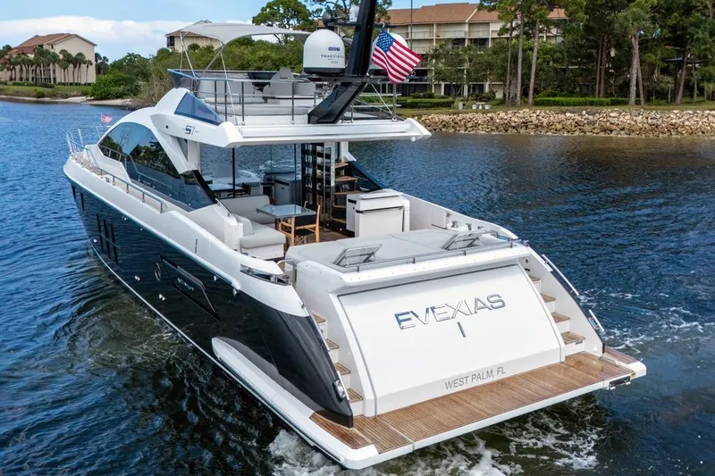 Slide: The Image of Luxury 2020 Azimut S7 FLY yacht cruising on a scenic waterway. - 10