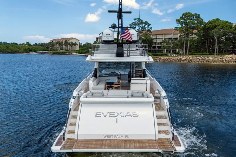 Slide: The Image of Azimut S7 FLY 2020 yacht cruising on a serene waterway, rear view. - 11