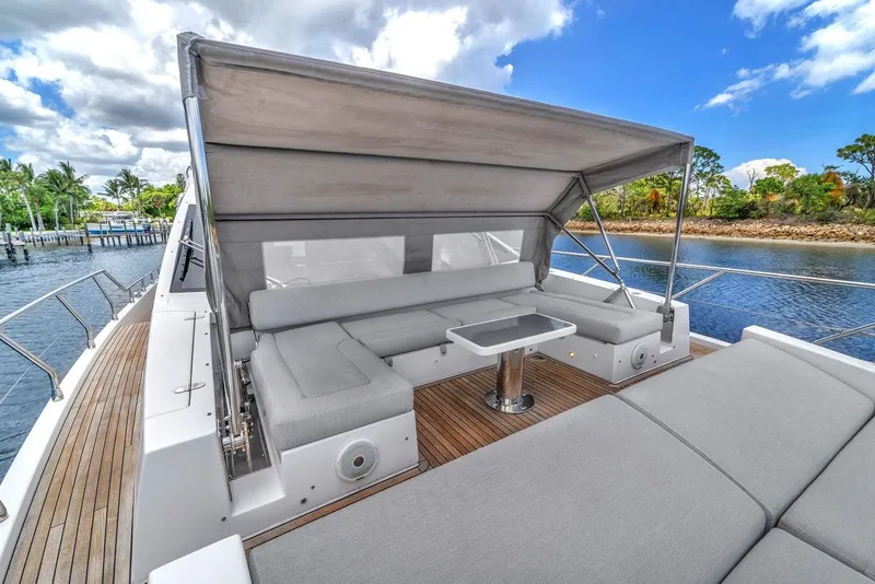 Slide: The Image of Luxurious 2020 Azimut S7 FLY yacht with spacious outdoor seating and canopy. - 16
