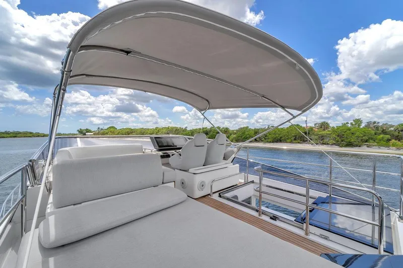 Slide: The Image of Luxurious 2020 Azimut S7 FLY yacht with spacious deck and canopy, cruising on a sunny day. - 18