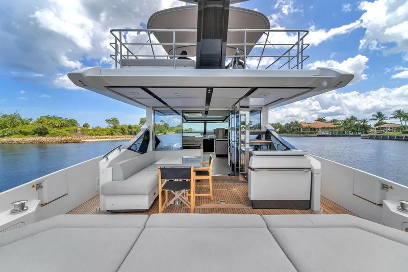 Slide: The Image of Luxurious 2020 Azimut S7 FLY yacht with spacious deck and modern seating, cruising on a sunny day. - 29
