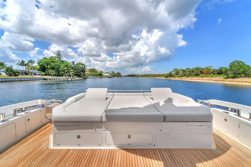 Slide: The Image of Luxurious Azimut S7 FLY 2020 yacht deck with sun loungers, scenic waterway view. - 33