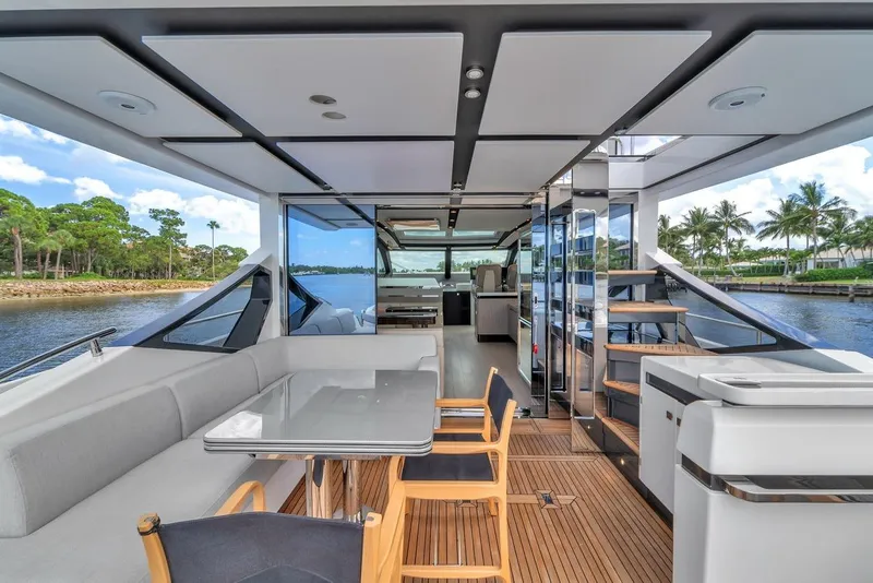Slide: The Image of Luxurious 2020 Azimut S7 FLY yacht interior with modern seating and scenic water views. - 36