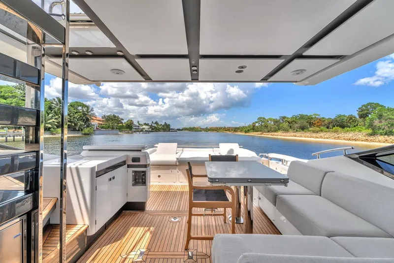 Slide: The Image of Luxurious 2020 Azimut S7 FLY yacht deck with elegant seating and scenic water view. - 37