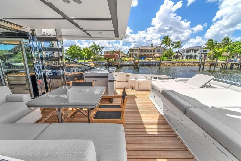 Slide: The Image of Luxurious 2020 Azimut S7 FLY yacht deck with elegant seating and waterfront view. - 38