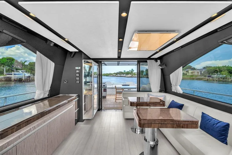 Slide: The Image of Luxurious interior of 2020 Azimut S7 FLY yacht with elegant seating and scenic water views. - 41