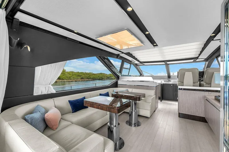 Slide: The Image of Luxurious interior of 2020 Azimut S7 FLY yacht with elegant seating and panoramic windows. - 44