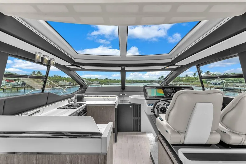 Slide: The Image of Luxurious 2020 Azimut S7 FLY yacht interior with panoramic windows and modern helm. - 48