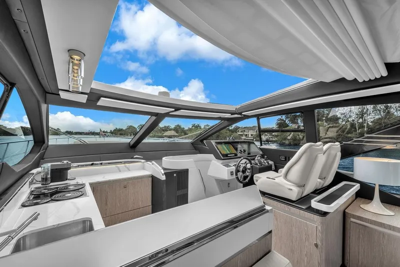 Slide: The Image of Luxurious interior of 2020 Azimut S7 FLY yacht with modern helm and kitchen area. - 49