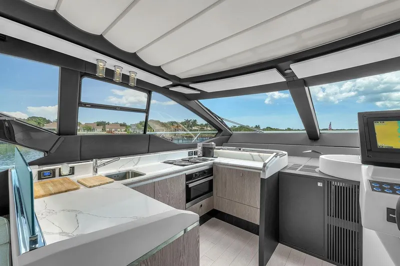 Slide: The Image of Luxurious interior of 2020 Azimut S7 FLY yacht with modern kitchen and panoramic windows. - 50