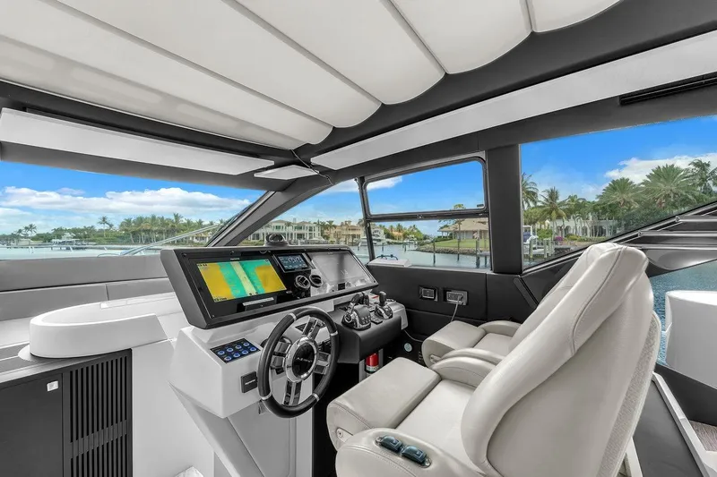 Slide: The Image of Luxurious 2020 Azimut S7 FLY yacht cockpit with modern navigation system and plush seating. - 53
