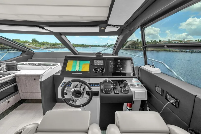 Slide: The Image of Luxurious 2020 Azimut S7 FLY yacht cockpit with modern navigation system and scenic water view. - 54