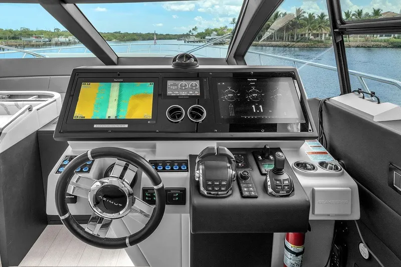 Slide: The Image of Cockpit of 2020 Azimut S7 FLY yacht with advanced navigation displays and controls. - 55