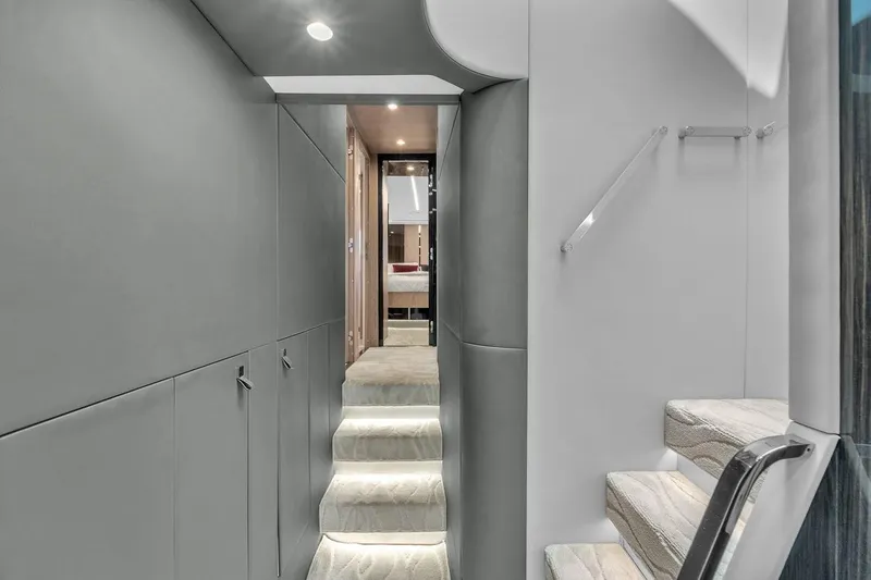 Slide: The Image of Interior of 2020 Azimut S7 FLY yacht, featuring modern staircase and sleek design. - 59