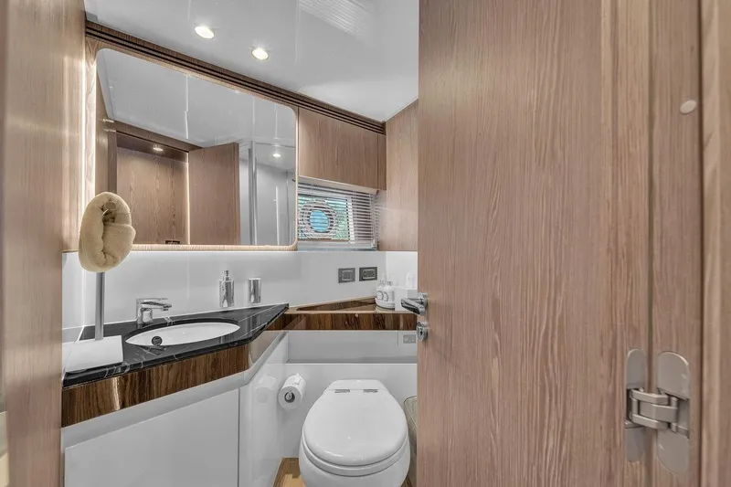 Slide: The Image of Luxurious bathroom interior of 2020 Azimut S7 FLY yacht with modern fixtures and wood accents. - 64
