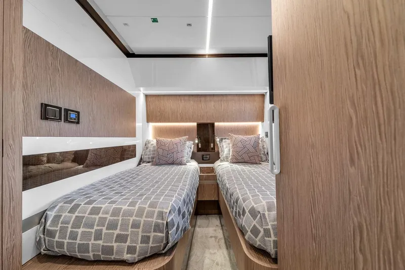 Slide: The Image of Luxurious twin cabin interior on 2020 Azimut S7 FLY yacht, featuring modern wood finishes. - 65