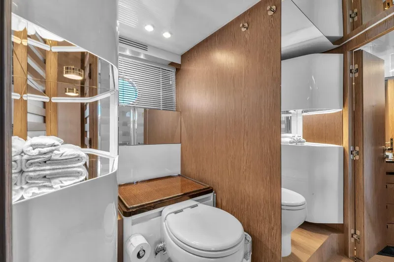 Slide: The Image of Luxurious bathroom in 2020 Azimut S7 FLY yacht with modern wood accents and elegant fixtures. - 76