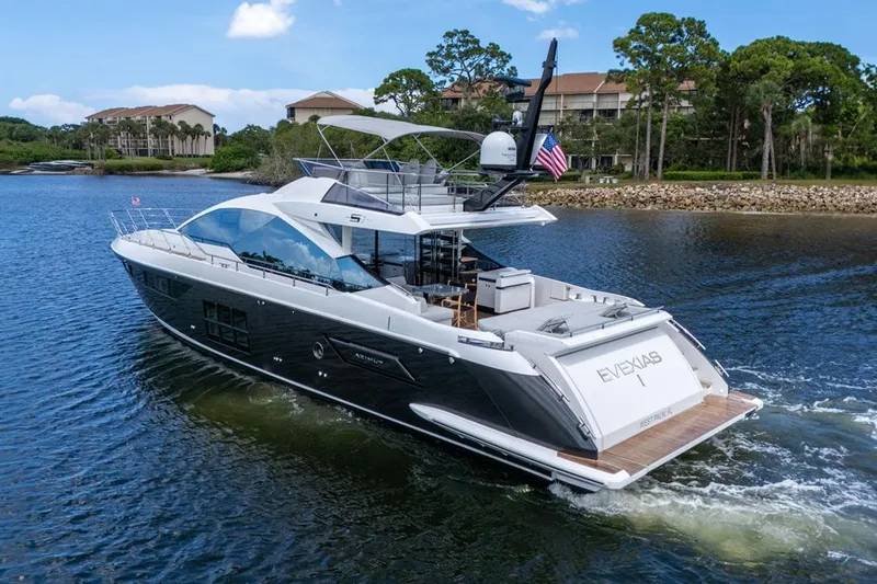 Slide: The Image of Luxury 2020 Azimut S7 FLY yacht cruising on a scenic waterway. - 9