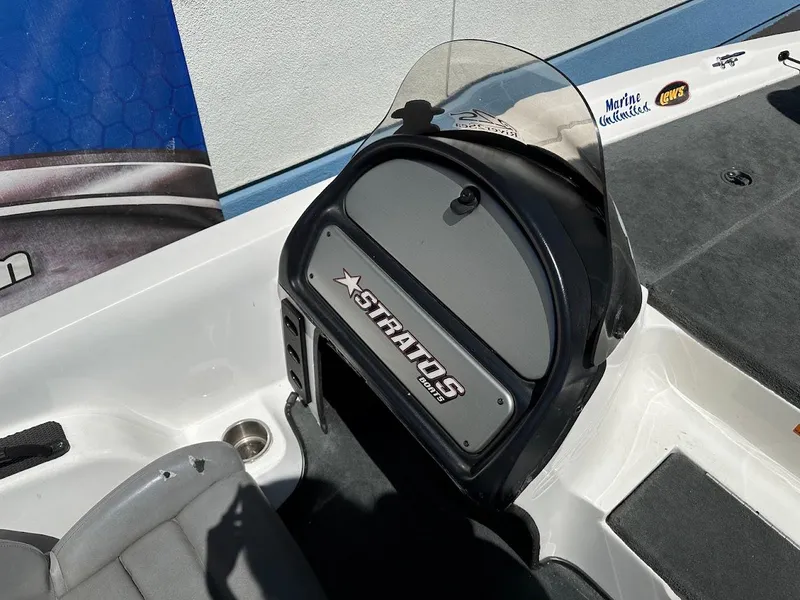 Slide: The Image of 2004 Stratos 285 PRO XL DC boat dashboard with logo and windshield. - 15