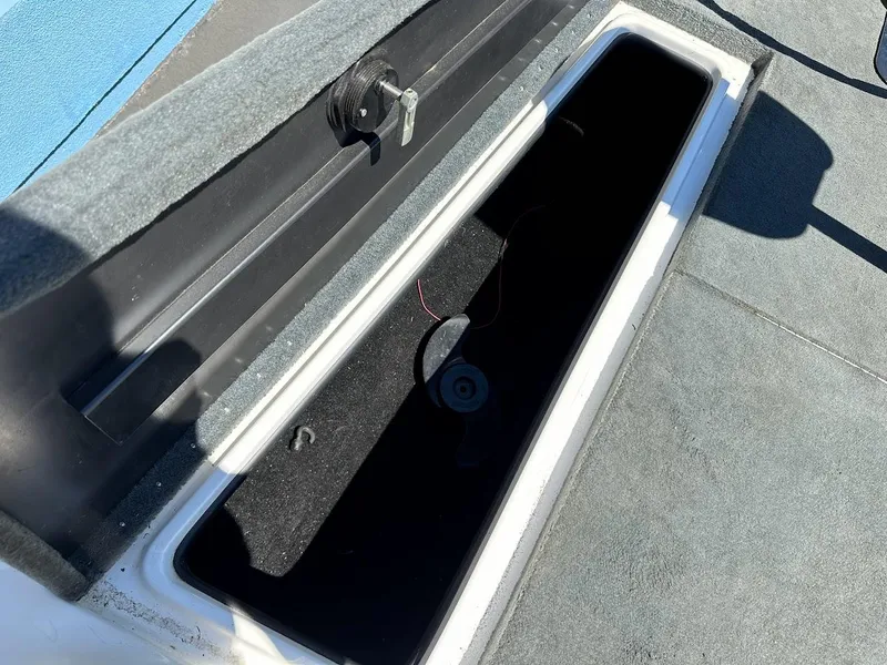 Slide: The Image of Open storage compartment in 2004 Stratos 285 PRO XL DC boat. - 26