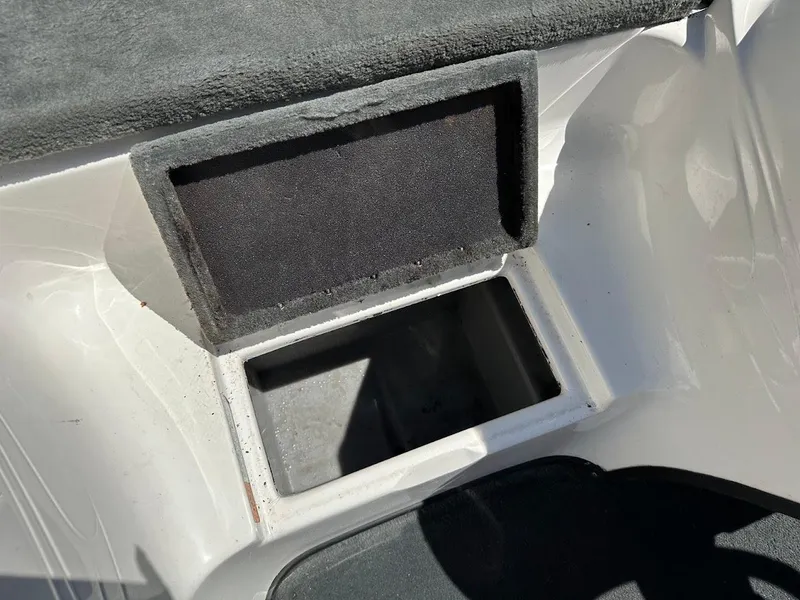 Slide: The Image of Open storage compartment on a 2004 Stratos 285 PRO XL DC boat. - 28