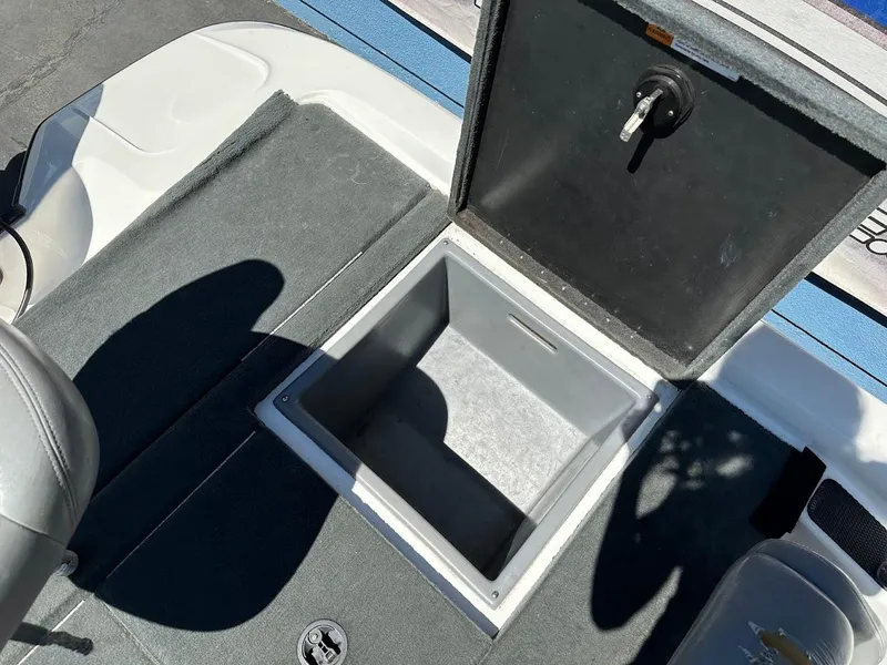 Slide: The Image of Open storage compartment on 2004 Stratos 285 PRO XL DC boat deck. - 29