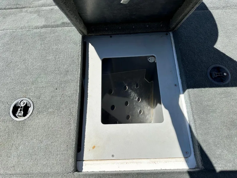 Slide: The Image of Open storage compartment on 2004 Stratos 285 PRO XL DC boat deck. - 30