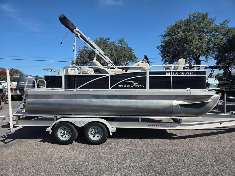 Slide: The Image of 2019 Bennington SV 188 SFV 8' Narrow Beam pontoon boat on trailer. - 0