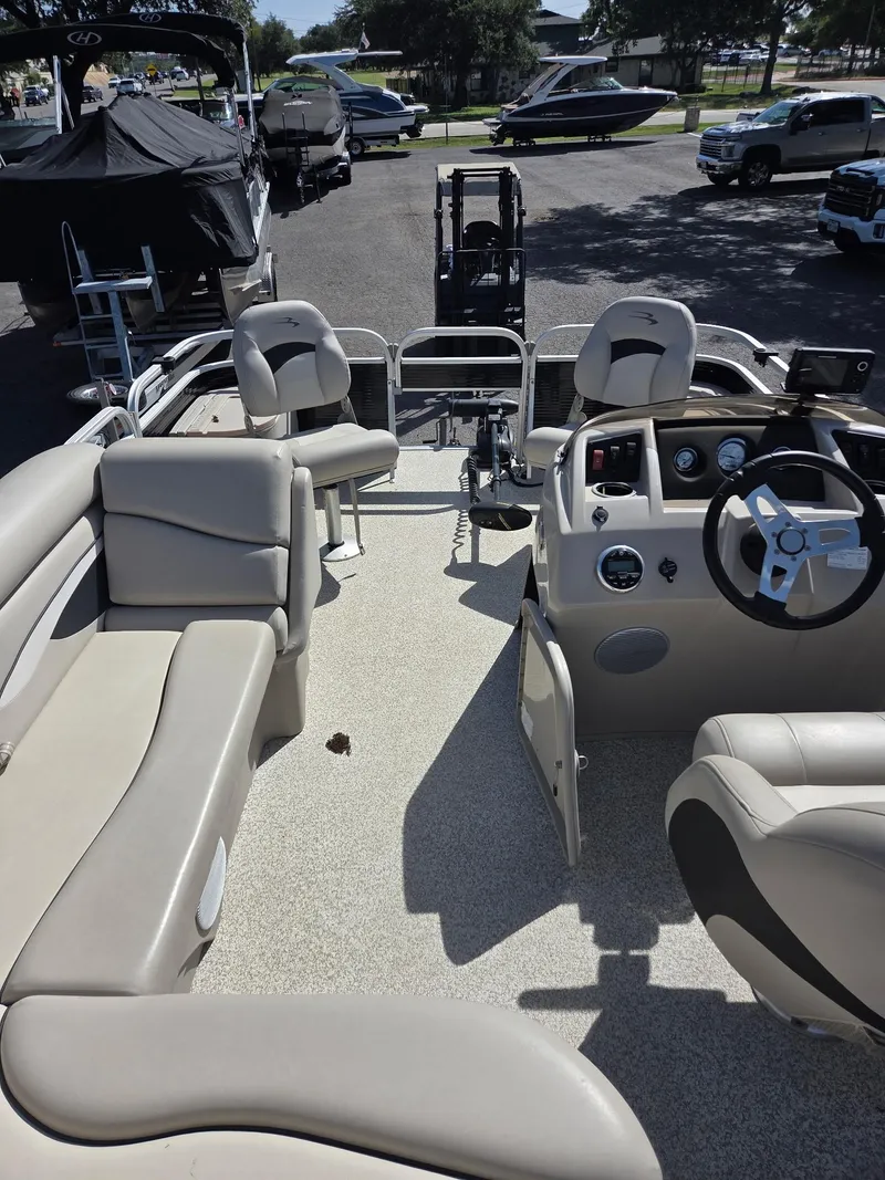 Slide: The Image of 2019 Bennington SV 188 SFV 8' Narrow Beam pontoon boat interior with seating and steering console. - 10
