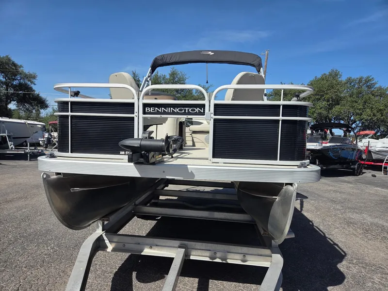 Slide: The Image of 2019 Bennington SV 188 SFV 8' Narrow Beam pontoon boat on trailer, sunny day. - 6