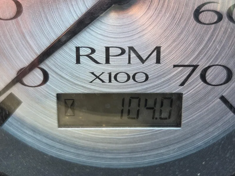 Slide: The Image of Close-up of a tachometer showing 1040 RPM on a Bennington SV 188 SFV boat. - 9