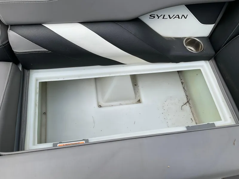 Slide: The Image of Control panel of a 2019 Sylvan SE-CRS25 boat with switches and steering wheel. - 10