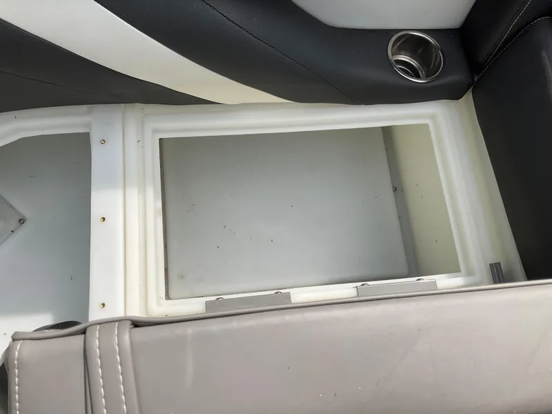 Slide: The Image of Stainless steel storage compartment on 2019 Sylvan SE-CRS25 boat with granite countertop. - 14