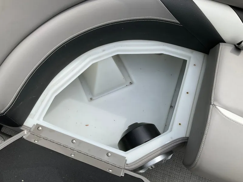 Slide: The Image of Storage compartment in 2019 Sylvan SE-CRS25 boat, featuring gray upholstery and white interior. - 16