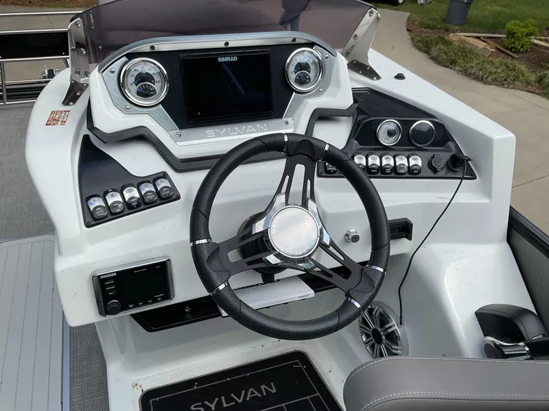Slide: The Image of 2019 Sylvan SE-CRS25 boat dashboard with steering wheel and control panel. - 31