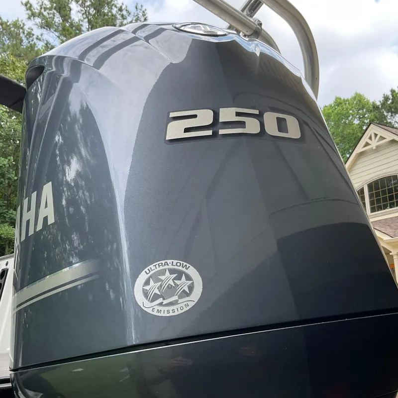 Slide: The Image of Yamaha 250 outboard motor with ultra-low emission label, attached to a 2019 Sylvan SE-CRS25. - 33