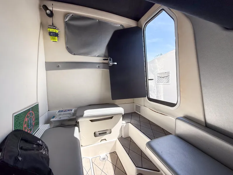 Slide: The Image of Interior cabin of 2018 Sunsation 32 CCX boat, featuring seating and storage. - 10