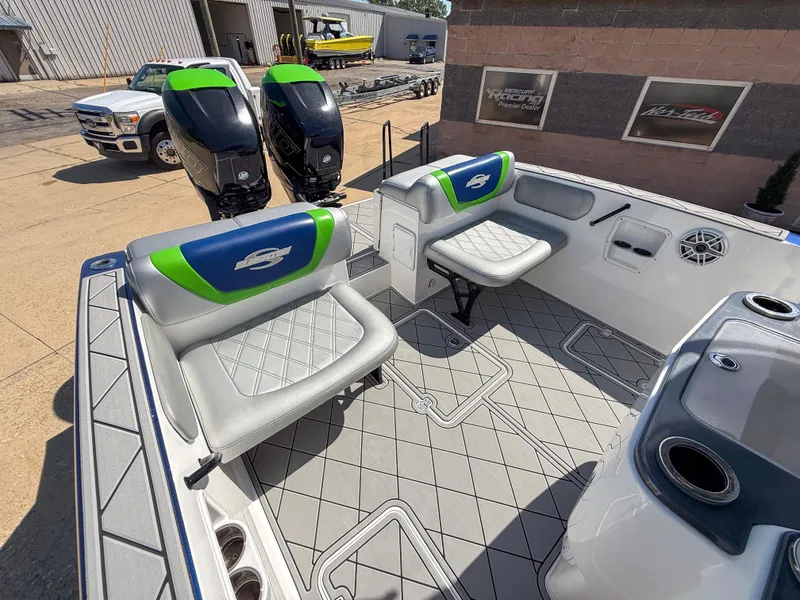 Slide: The Image of 2018 Sunsation 32 CCX boat interior with seating and dual outboard motors. - 5