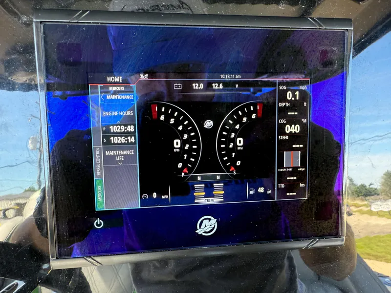 Slide: The Image of Dashboard of a 2018 Sunsation 32 CCX boat showing engine hours and gauges. - 6