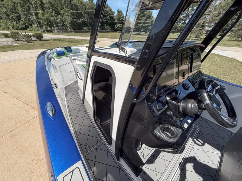 Slide: The Image of 2018 Sunsation 32 CCX boat interior with modern dashboard and seating. - 7