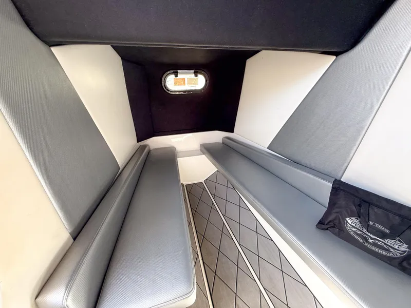 Slide: The Image of 2018 Sunsation 32 CCX cabin interior with gray seating and geometric flooring. - 9