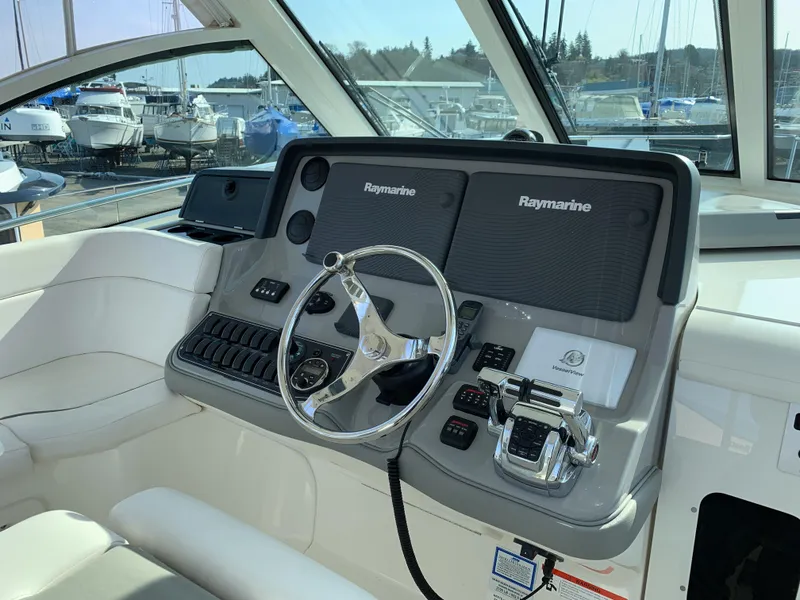 Slide: The Image of Helm of 2013 Boston Whaler 345 Conquest with Raymarine electronics and steering wheel. - 10