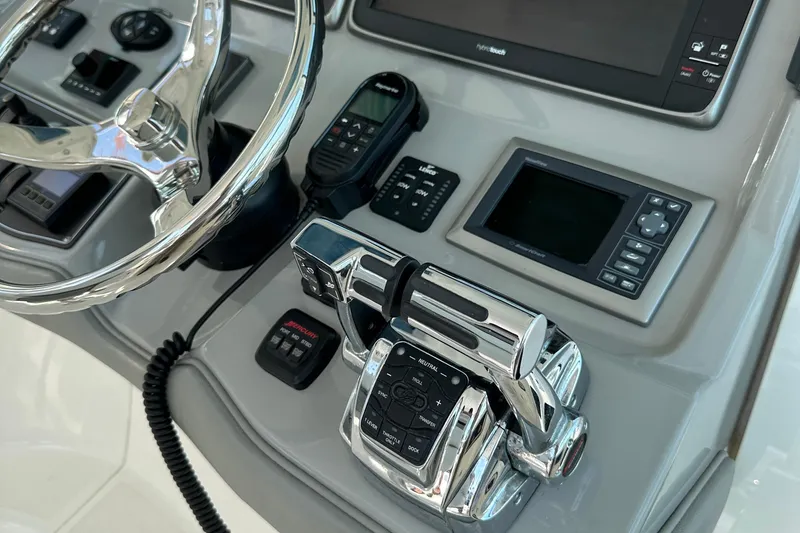 Slide: The Image of Control panel of a 2013 Boston Whaler 345 Conquest boat with steering wheel and electronics. - 17