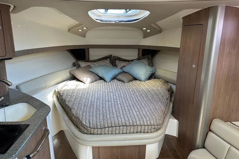Slide: The Image of Luxurious cabin interior of 2013 Boston Whaler 345 Conquest with cozy bedding. - 28