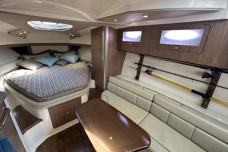 Slide: The Image of Luxurious interior of 2013 Boston Whaler 345 Conquest with cozy bed and seating area. - 29