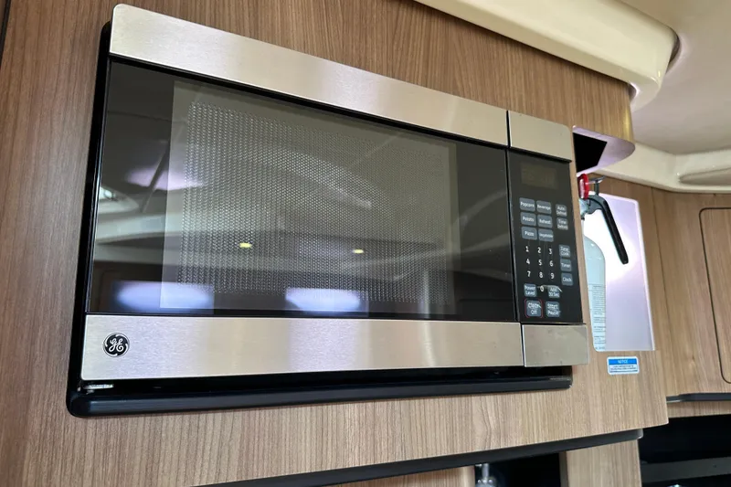 Slide: The Image of GE microwave in 2013 Boston Whaler 345 Conquest boat kitchen. - 35