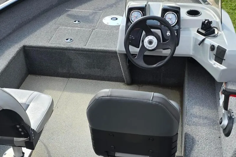 Slide: The Image of 2019 Tracker PGV16 boat interior with steering wheel and seating. - 4