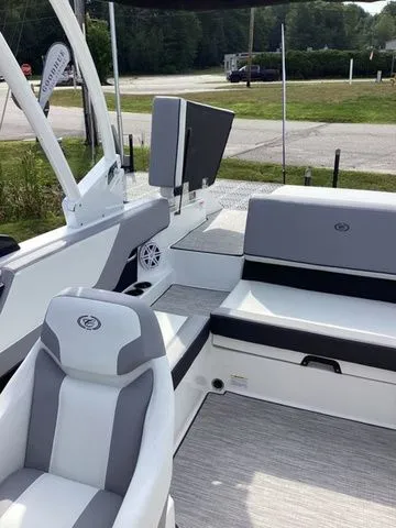 Slide: The Image of 2026 Cobalt CS23 boat interior with gray and white seating, modern design. - 10